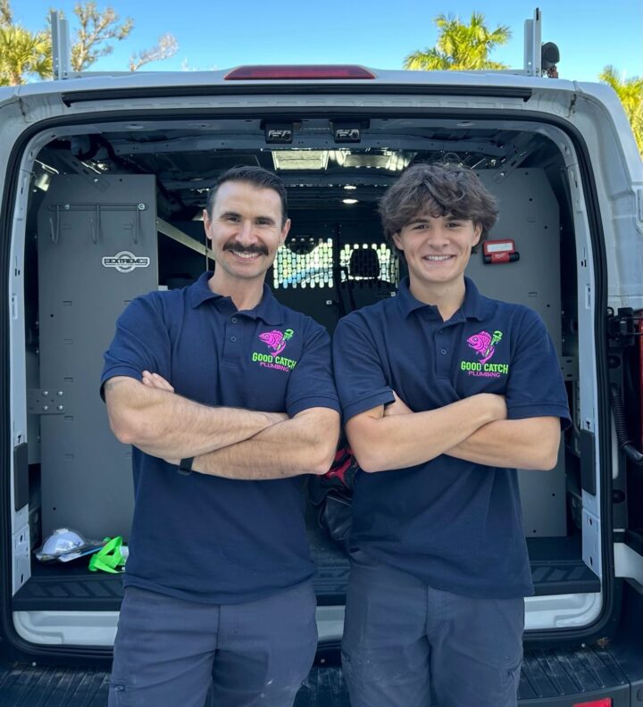 The Good Catch Plumbing team in front of their service van