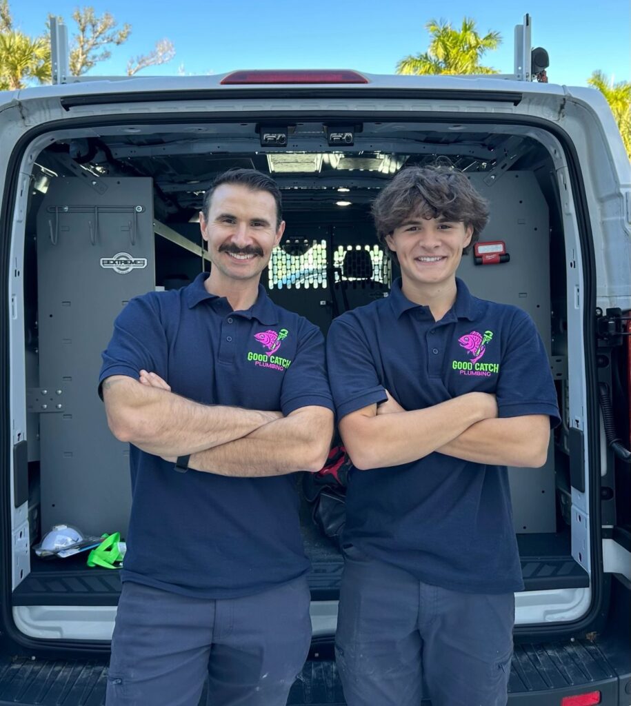 The Good Catch Plumbing team in front of their service van